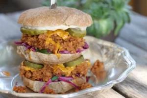 Talk about Community: The Burrowing Owl's massive food challenge, The Howard, draws its name from Grew Howard, owner of McCabe's Tavern. After eating his first messy sloppy joe, he jested that he could have had two. Five minutes later, Cody slid a double-decker and a knife his way. The rest is history.