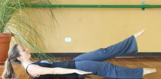 low boat pose engages your core and relieves stress as a part of stress relief yoga
