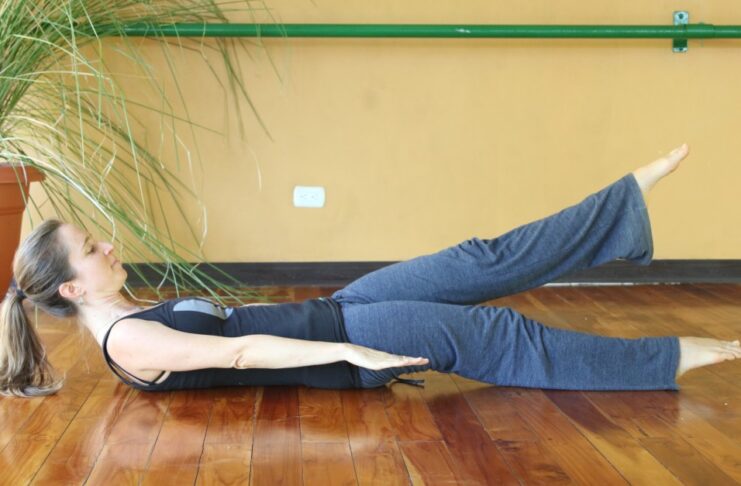 low boat pose engages your core and relieves stress as a part of stress relief yoga