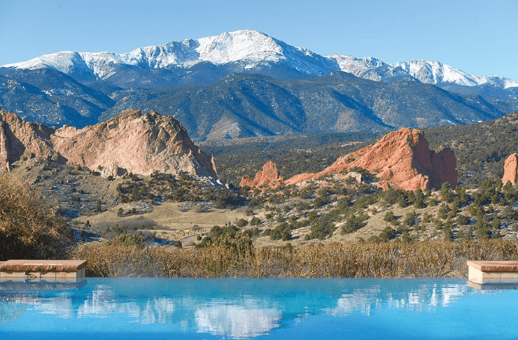 Pikes Peak and Garden of the Gods beyond the infinity pool. Photo by Bryan Oller.