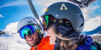 A couple rides a ski lift on a speed date through the Luvbyrd dating app