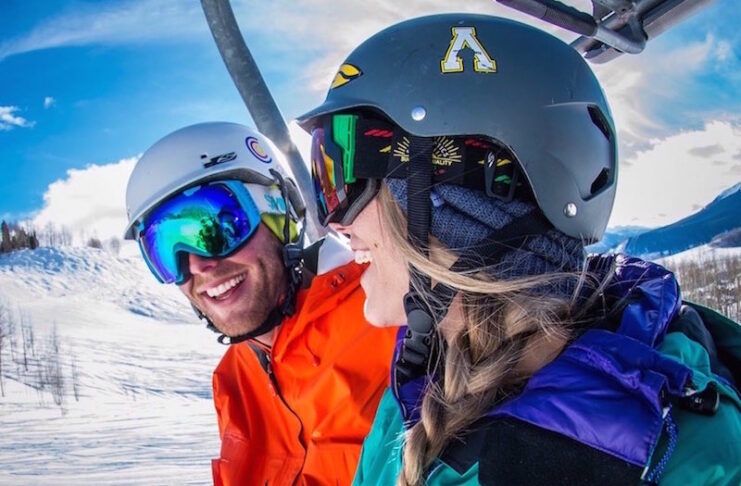 A couple rides a ski lift on a speed date through the Luvbyrd dating app