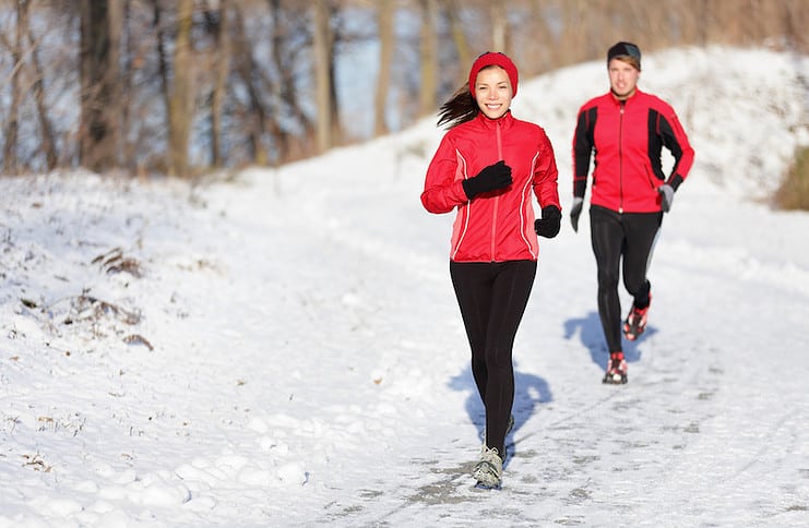 runners on winter trail