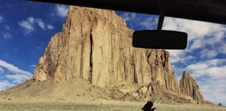 Shiprock through the windshield of a VW bus. The dramatic rock formation is a sacred site on Navajo Nation lands.
