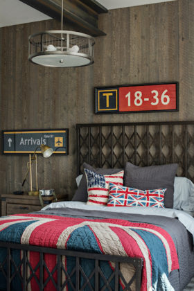 Bedroom with a British union-jack bedspread and pillows