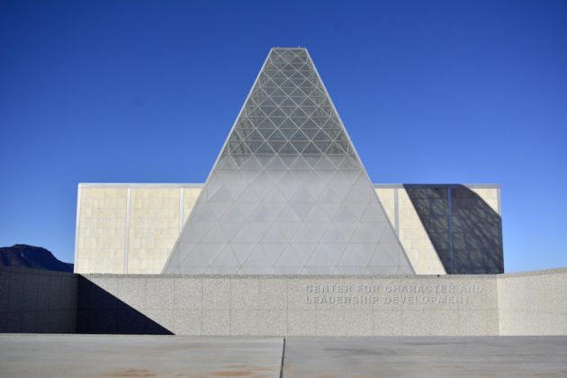 View of a silver pyramidical building with geometric shapes