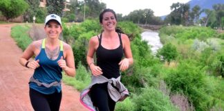 Two girls run in Jack Quinn's Running Club Tuesday