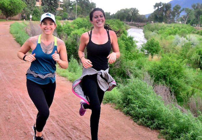 Two girls run in Jack Quinn's Running Club Tuesday