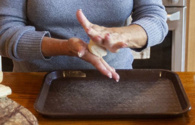 rolling the dough for tamales.