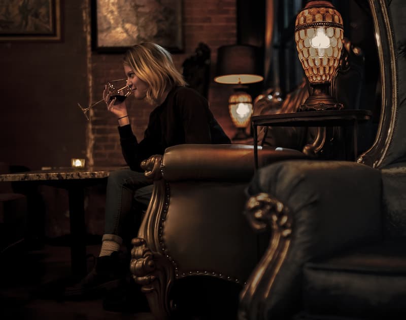 enjoying wine in cozy hideaways