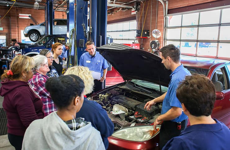Women learning what's under the hood at Honest Accurate Auto Service's women's car care clinic in east Colorado Springs.