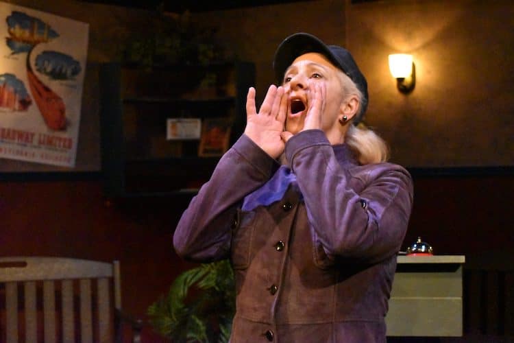 Woman shouts onstage in a performance at the Millibo Art Theatre's Women's Theatre Festival