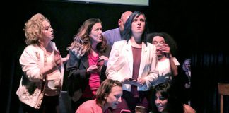A cast of women perform on stage at the Millibo women's theatre festival