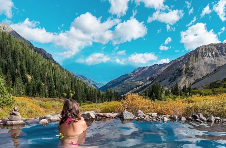 soaking woman in the high elevation conundrum creek hot spring