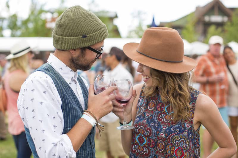 couple toasting wine at heritage fire