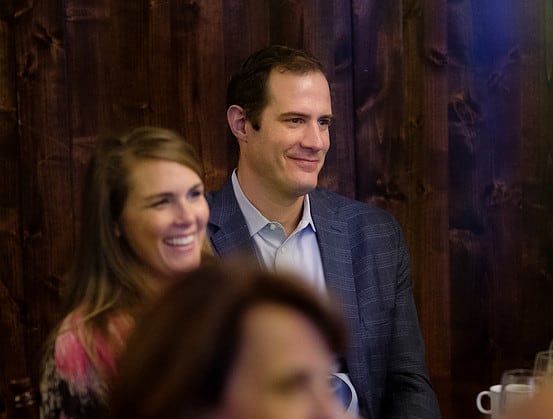 Photo of a man and a woman with another woman in the foreground