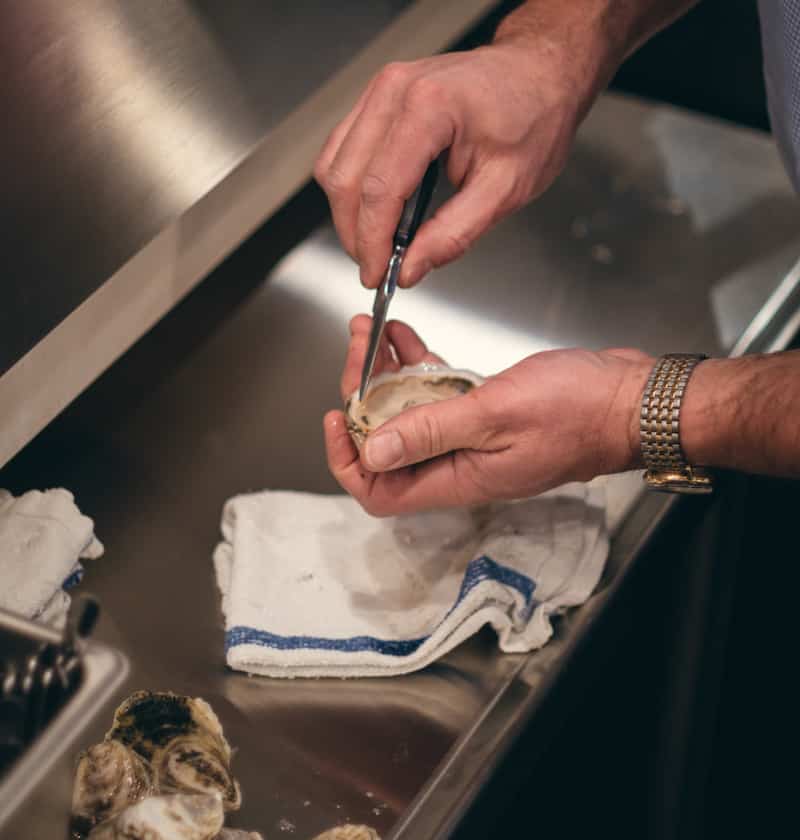 Shucking oysters at Jax Fish House & Oyster Bar, Colorado Springs