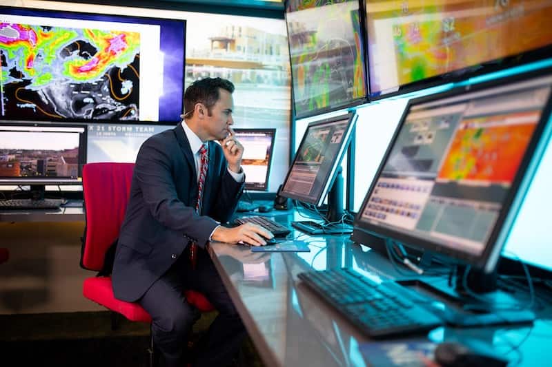 Matt Meister prepares the weather forecast in the FOX21 News studio. 