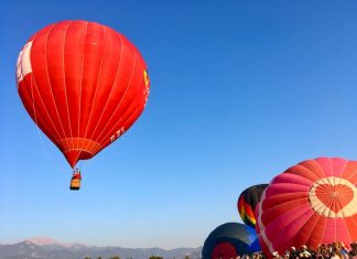 Colorado Springs Hot Air Balloons Rise Above Hot air balloons launch with Pikes Peak on the horizon