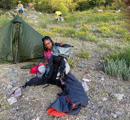 packing up camping materials during Patricia Cameron's hiking the Colorado Trail journey