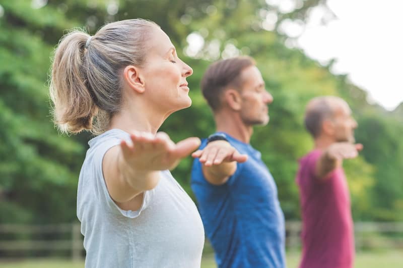 People doing yoga at The Retreat, an OakwoodLife community
