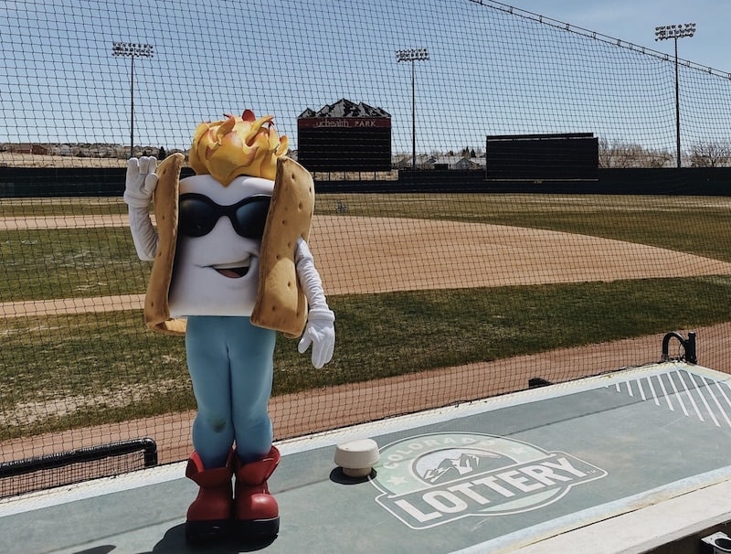 Toasty the S'more on top of Rocky Mountain Vibes dugout