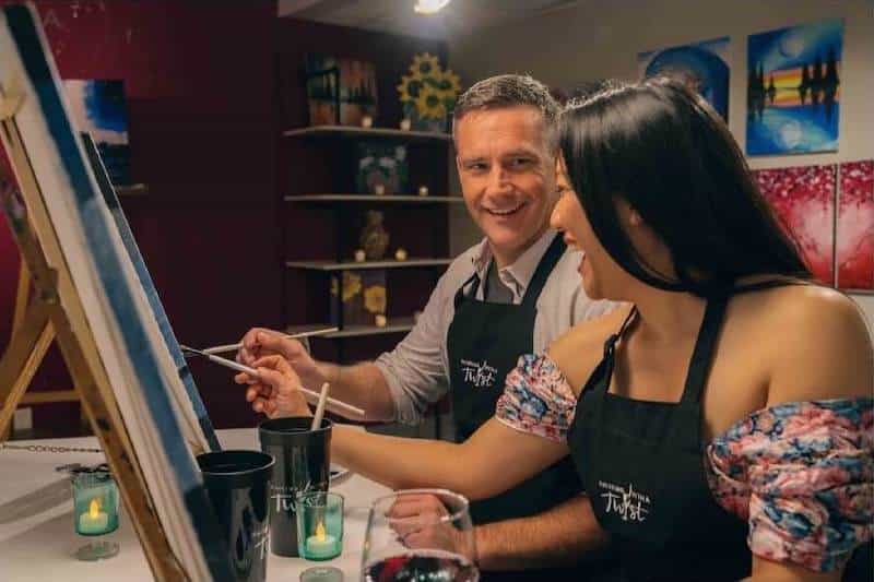 A couple paints during date night at Painting With a Twist in Colorado Springs