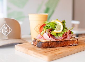 Toastique new openings colorado springs Toastique: gourmet toast stacked with meat next to a pressed juice and toastique hat