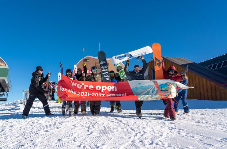 Skiers and snowboarders break the ribbon on Opening Day 2021 at Keystone