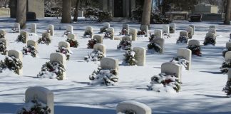tombstones in a cemetery blanketed with snow
