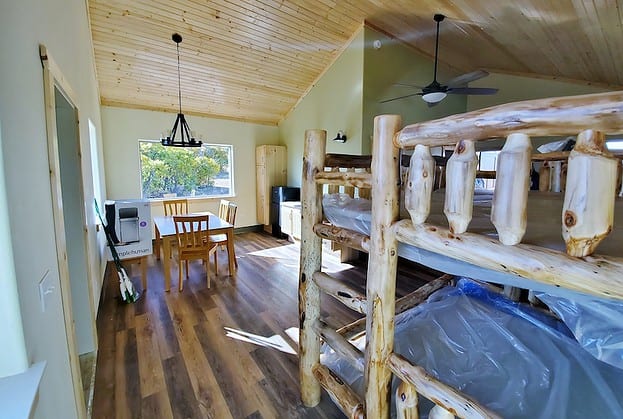interor cabin featuring two sets of bunkbeds.