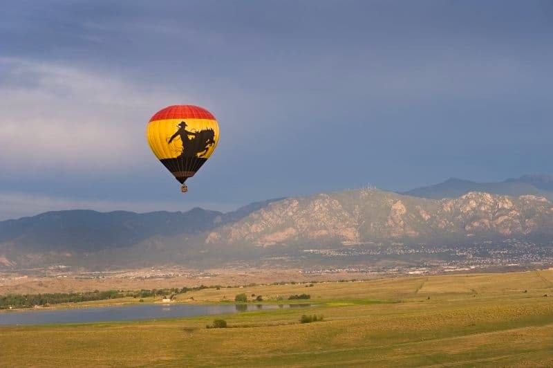 The Adventures Out West cowboy hot air balloon soars high above Colorado Springs