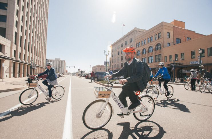 people using PikeRide bikes to get around downtown Colorado Springs