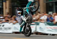High Flying Fun at the Pikes Peak Hill Climb Fan Fest Motorcycle wheelie at Fan Fest for the Broadmoor Pikes Peak International Hill Climb in Colorado Springs