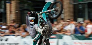 High Flying Fun at the Pikes Peak Hill Climb Fan Fest Motorcycle wheelie at Fan Fest for the Broadmoor Pikes Peak International Hill Climb in Colorado Springs