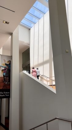 Ascending to an exhibition inside the Art Deco Fine Arts Center.