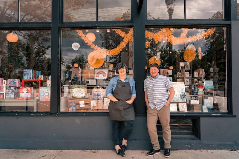 Owners of Ladyfingers Letterpress outside Colorado Springs storefront