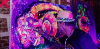 Live art experience as Diego Jaguart paints with fluorescent paint