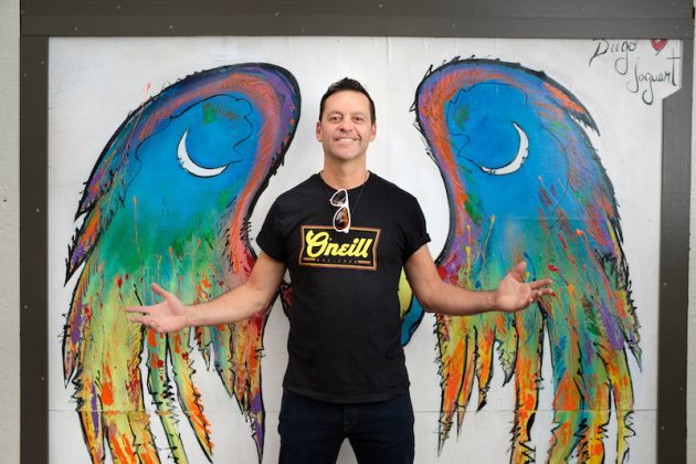 Diego Jaguart and his wings mural in Old Colorado City