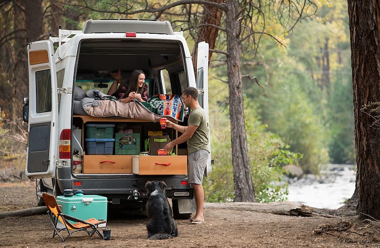 Campers in a van with hideaway insulated bowls