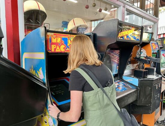 Natalie Johnson plays Ms. Pac-Man at the Manitou Penny Arcade
