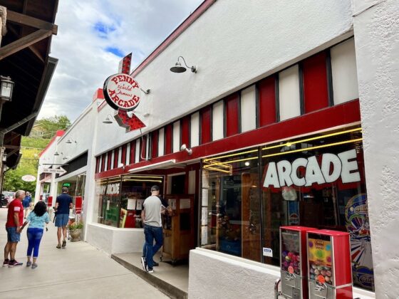 A sign and storefront at the Manitou Springs Penny Arcade