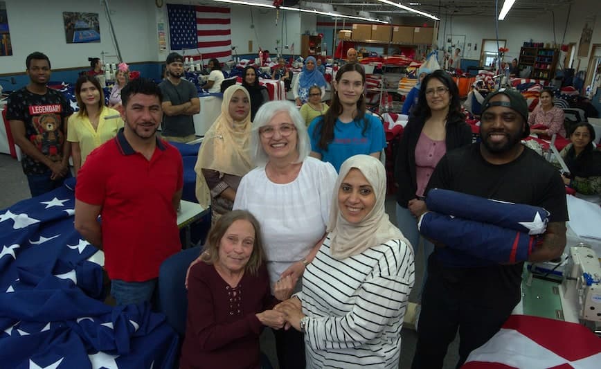 workers featured in the film The Flagmakers shown in the factory 