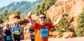 A runner gives two thumbs up in the Garden of the Gods 10 Mile run, a one of the most classic Colorado races