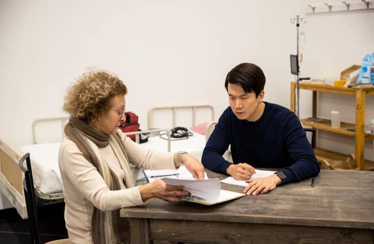 Aubergine cast members Ashley Crockett (left) and Sean Park (right) going over the script. Photo courtesy of the Ent Center of the Arts.
