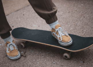 Mountainside Skateshop Person's feet on a skateboard from Mountainside Skateshop.