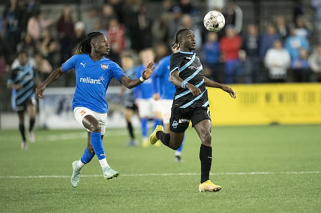 Switchbacks FC player heads soccer ball down in front of a Toros defender The season opener is one of the best things to do in Colorado Springs this weekend.
