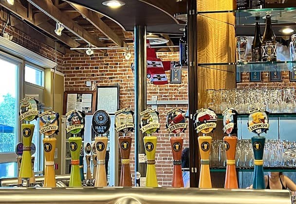 A long row of beer taps behind the bar at Bristol Brewing in Ivywild School, Colorado Springs.