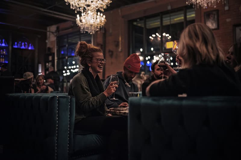 Happy hour at Cork & Cask, a stylish whiskey and wine bar in Colorado Springs New South End. 