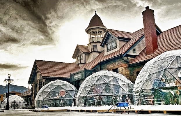 Heated igloos outside Brakeman's Burgers and Track 10 in Colorado Springs' Old Depot make for comfortable patio dining even in winter. Photo courtesy of the Old Depot.